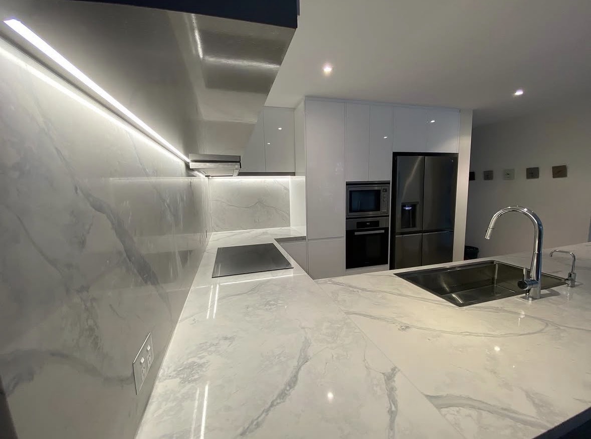 Modern kitchen LED strip and downlight installation
